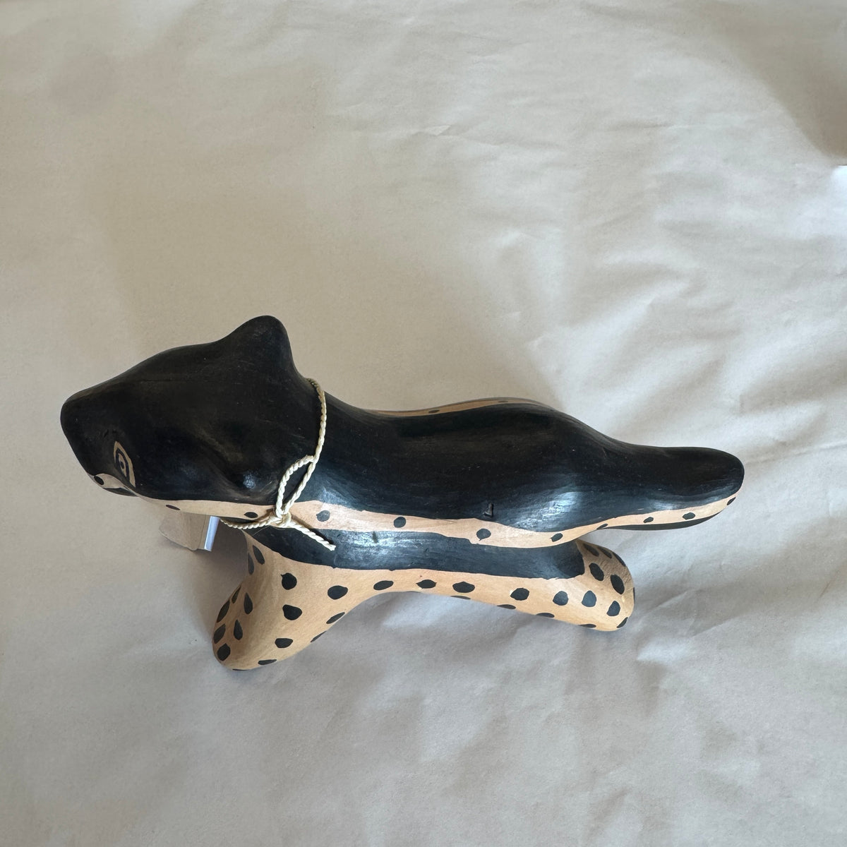 Waurá ceramic jaguar in black with pale spotted underside, by Tirawa Waurá